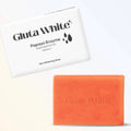 Orange soap bar with 'Gluta White' branding next to a white box with the same branding on a light beige background.